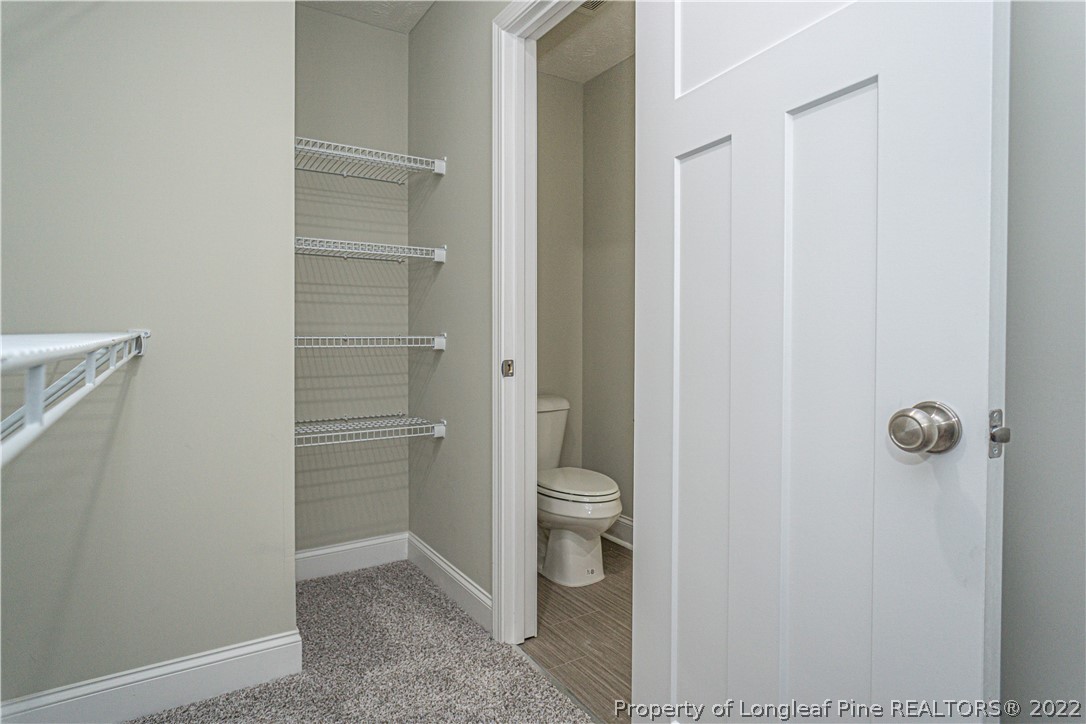 1628 Strickland Bridge Road Fayetteville, NC 28304 - Photo 22 of 34 a bathroom with a toilet and a shower