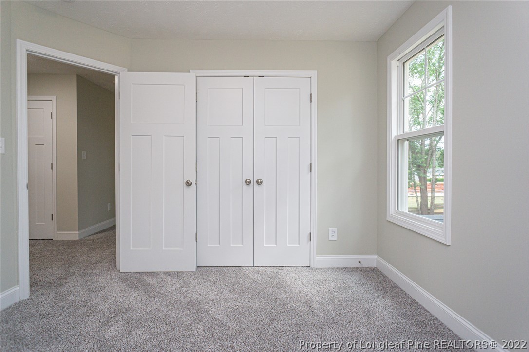 1628 Strickland Bridge Road Fayetteville, NC 28304 - Photo 24 of 34 an empty room with windows