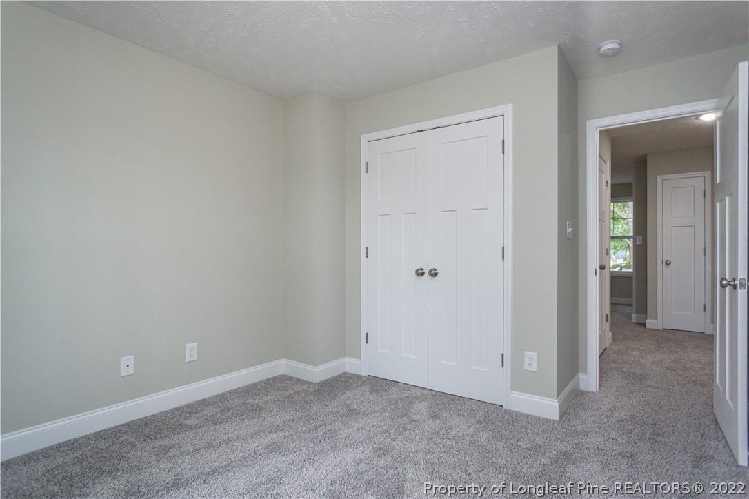 1628 Strickland Bridge Road Fayetteville, NC 28304 - Photo 27 of 34 an empty room with closet area