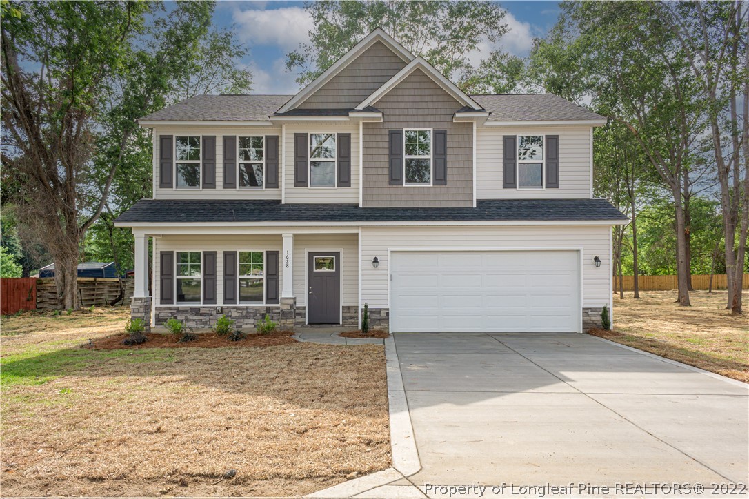 1628 Strickland Bridge Road Fayetteville, NC 28304 - Photo 29 of 34 a front view of a house with garden