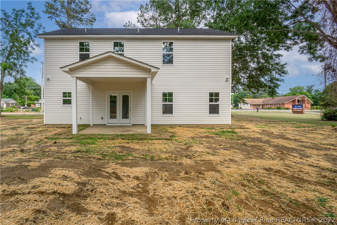 1628 Strickland Bridge Road Fayetteville, NC 28304 - Photo 30 of 34 a view of a house with a yard