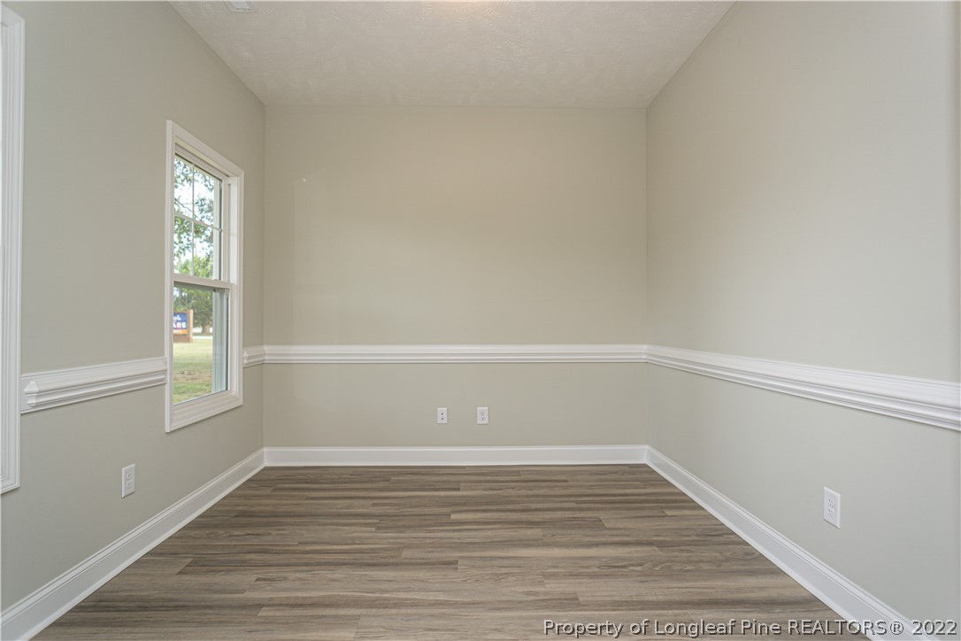 1628 Strickland Bridge Road Fayetteville, NC 28304 - Photo 7 of 34 a view of a small space with wooden floor and windows