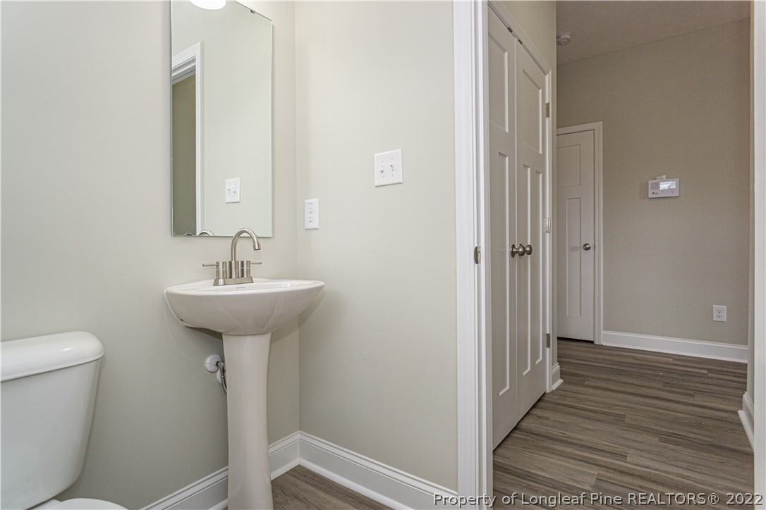 1628 Strickland Bridge Road Fayetteville, NC 28304 - Photo 8 of 34 a bathroom with a sink and mirror