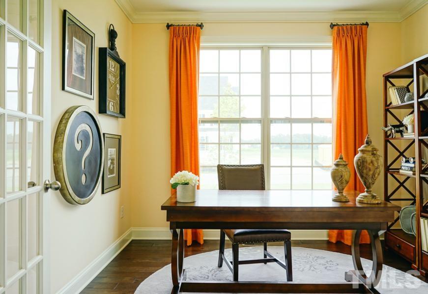 7709 Stonehenge Farm Lane Raleigh, NC 27613 - Photo 11 of 24 a view of a workspace with furniture and a window