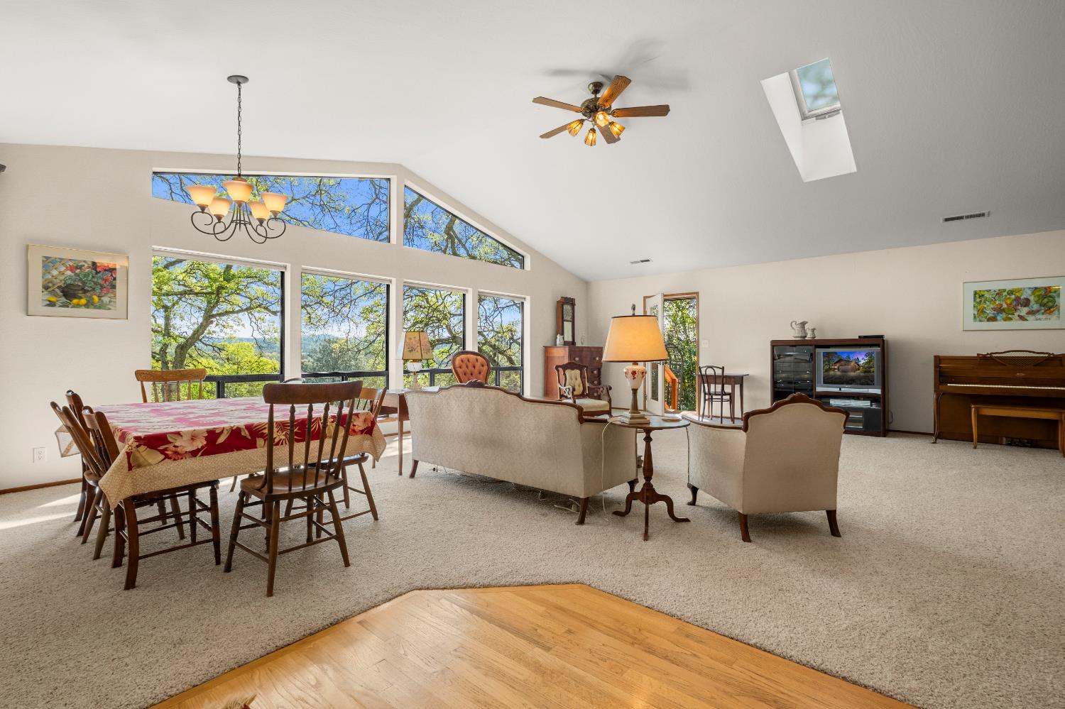 3099 Briw Road Placerville, CA 95667 - Photo 16 of 47 a dining room with wooden floor a chandelier a glass table and chairs