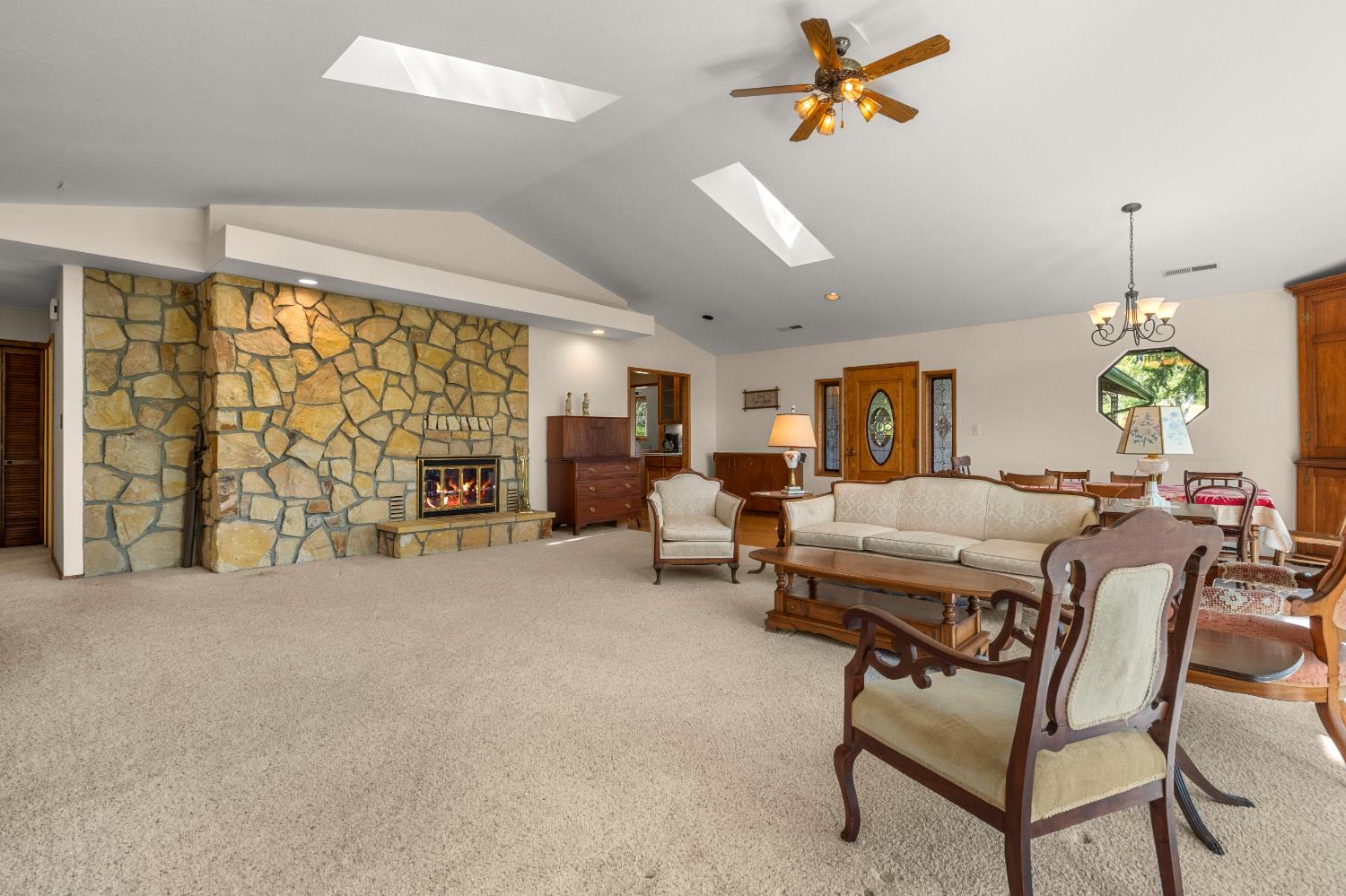 3099 Briw Road Placerville, CA 95667 - Photo 17 of 47 a living room with furniture a chandelier and a window