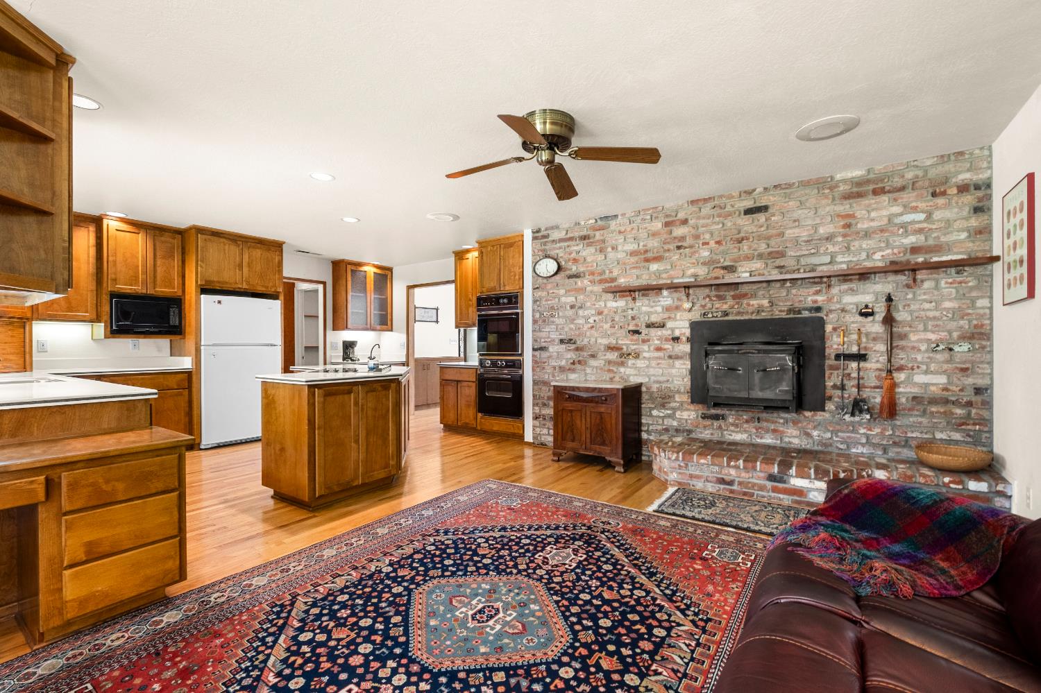 3099 Briw Road Placerville, CA 95667 - Photo 32 of 47 a living room with furniture a fireplace and a flat screen tv