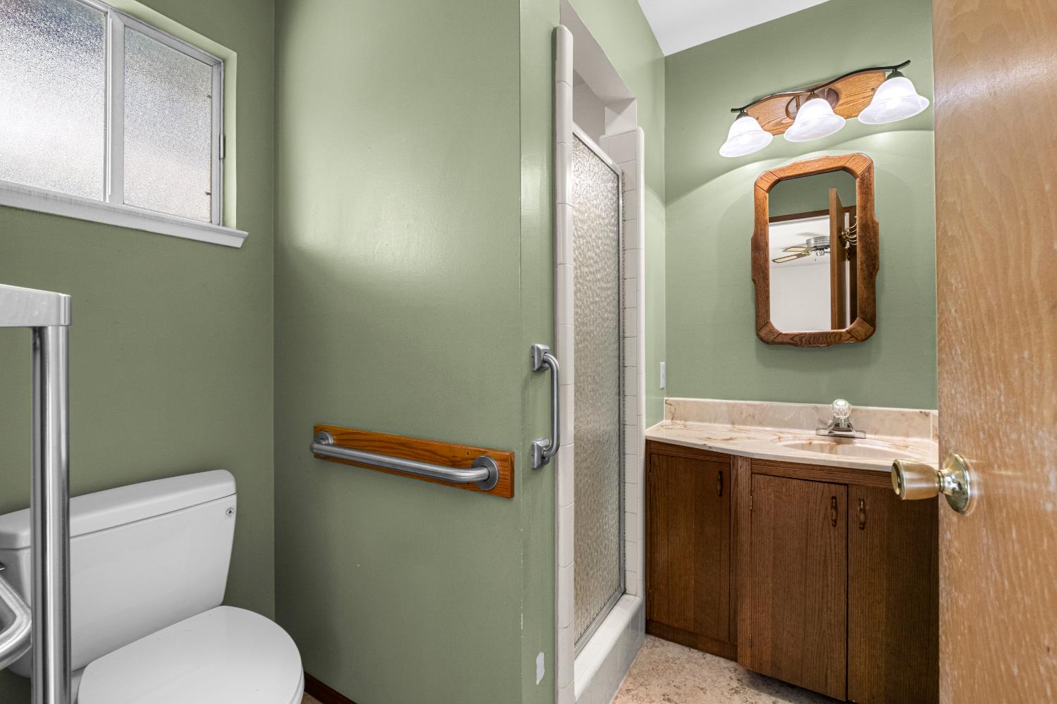 3099 Briw Road Placerville, CA 95667 - Photo 34 of 47 a bathroom with a toilet sink and mirror