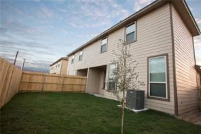 a view of a backyard with potted plants