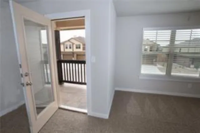 a view of a hallway with a window
