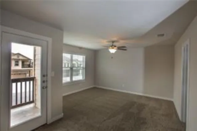 a view of an empty room with a window