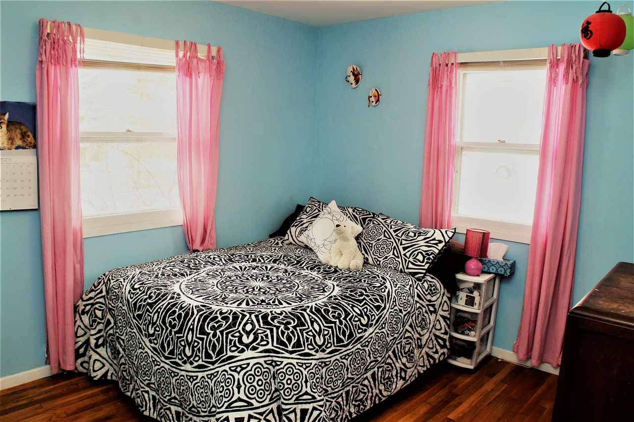 10619 Grover Oaks Road Roscoe, IL 61073 - Photo 16 of 24 a bedroom with a bed and a window