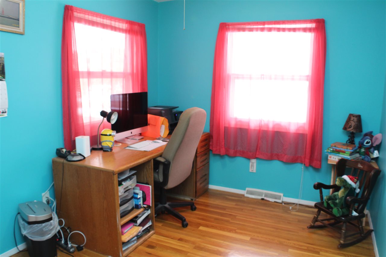10619 Grover Oaks Road Roscoe, IL 61073 - Photo 18 of 24 a workspace with furniture and a wooden floor