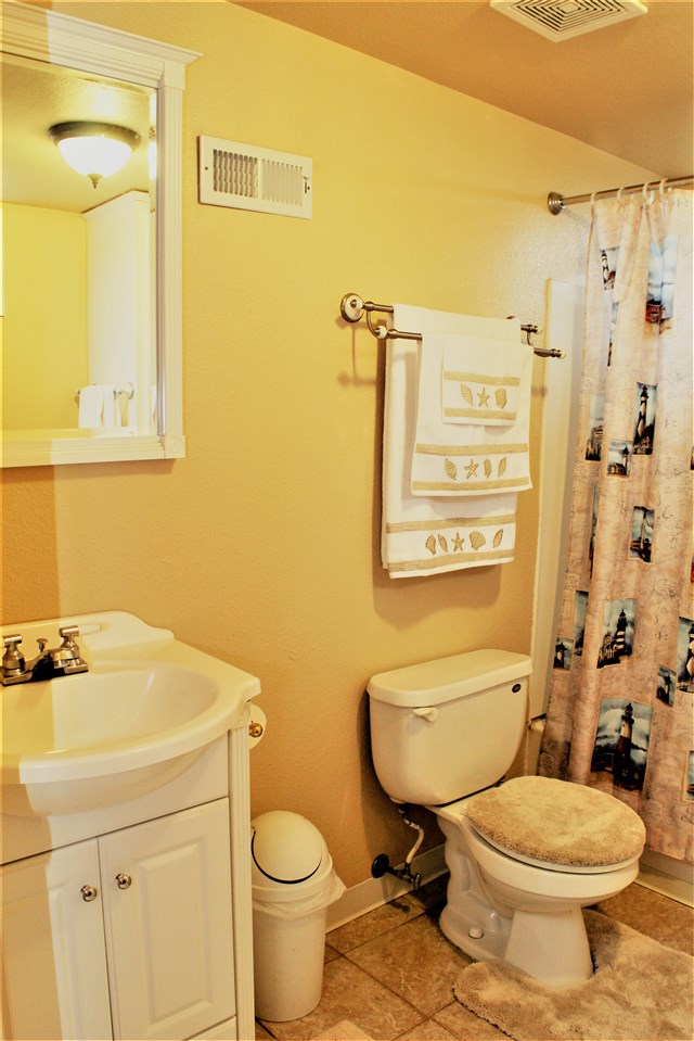 10619 Grover Oaks Road Roscoe, IL 61073 - Photo 21 of 24 a bathroom with a toilet sink and mirror