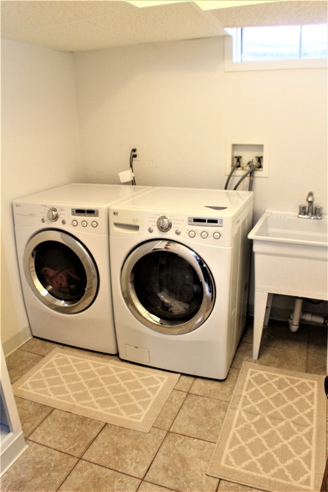 10619 Grover Oaks Road Roscoe, IL 61073 - Photo 23 of 24 a utility room with dryer and washer
