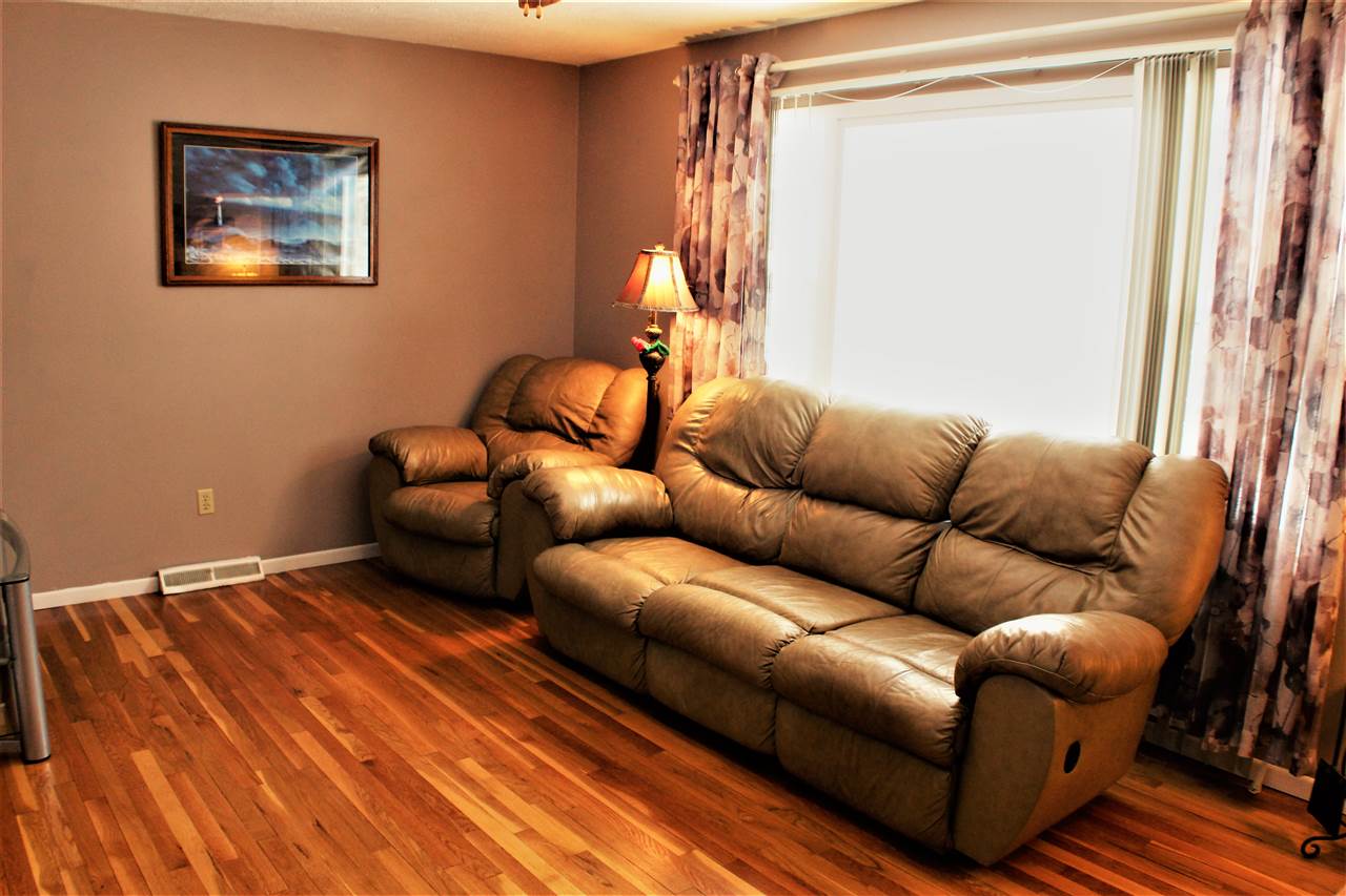 10619 Grover Oaks Road Roscoe, IL 61073 - Photo 8 of 24 a living room with furniture and a window