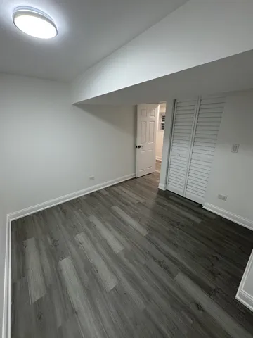 an empty room with wooden floor