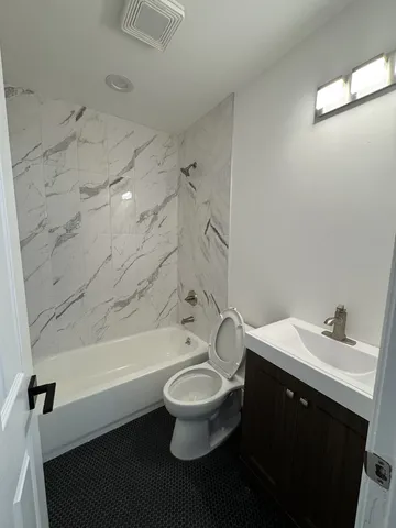 a bathroom with a sink a toilet and a bathtub