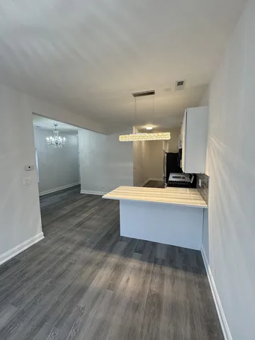 a view of kitchen with wooden floor