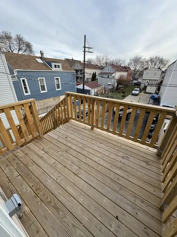 a view of a balcony with two chairs