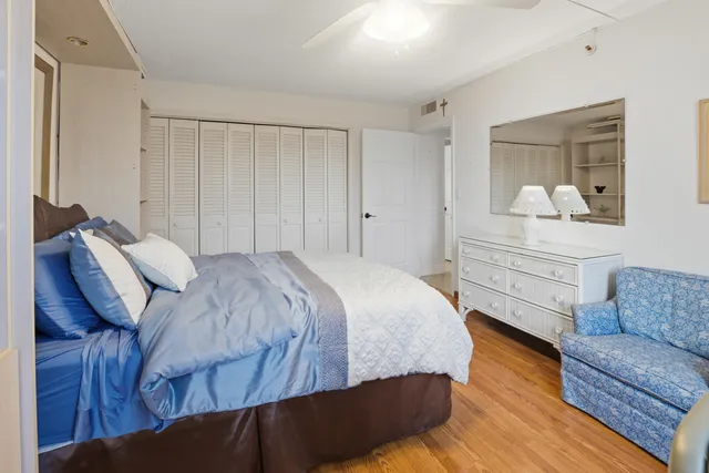 a bedroom with a bed and a couch