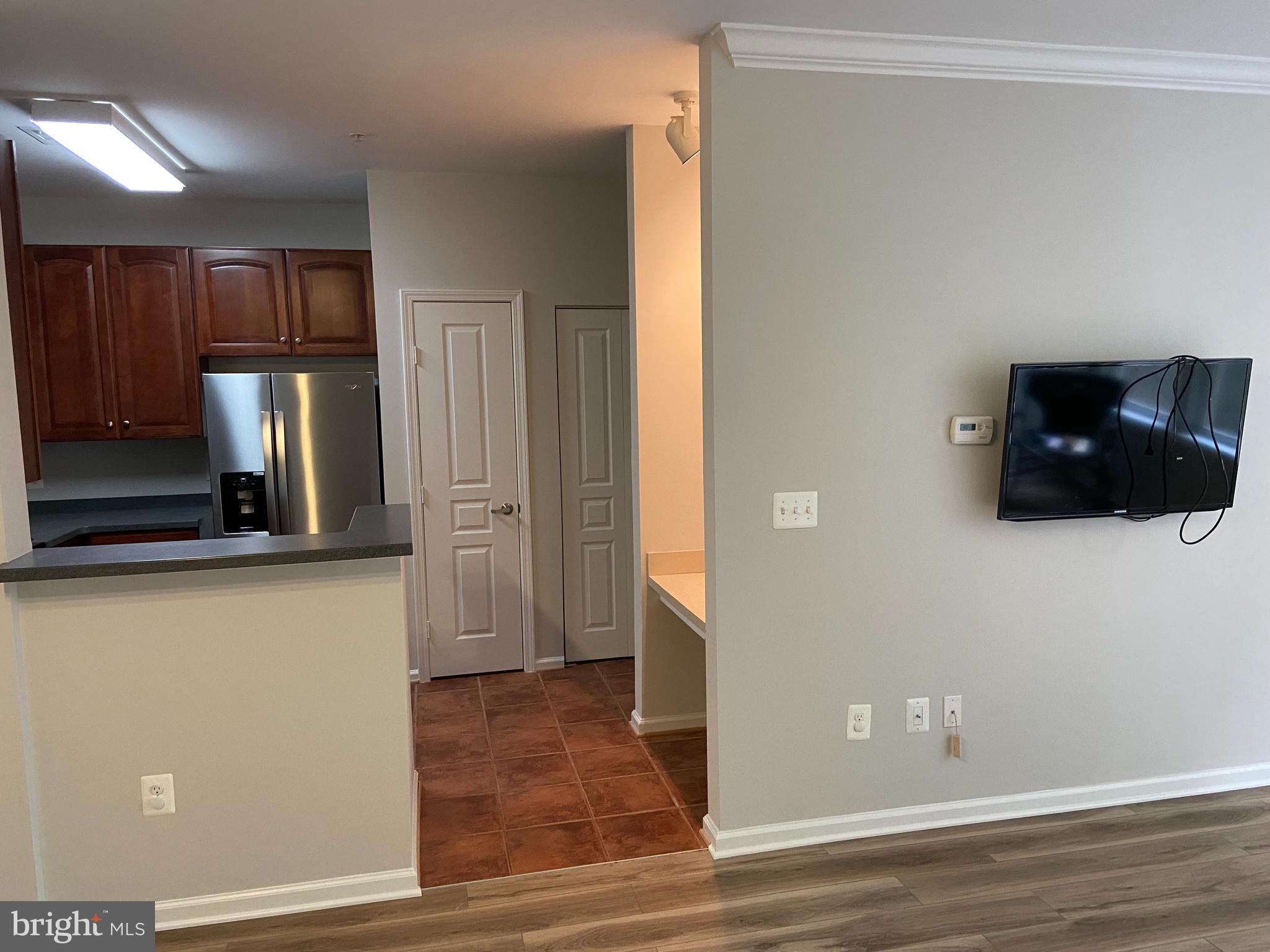 12001 Market Street, Unit 206 Reston, VA 20190 - Photo 6 of 22 Open to Spacious Living Room & Dining Area