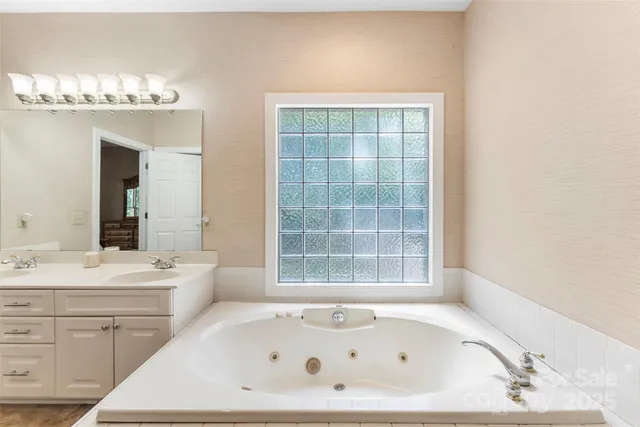 a bathroom with a bathtub and a sink