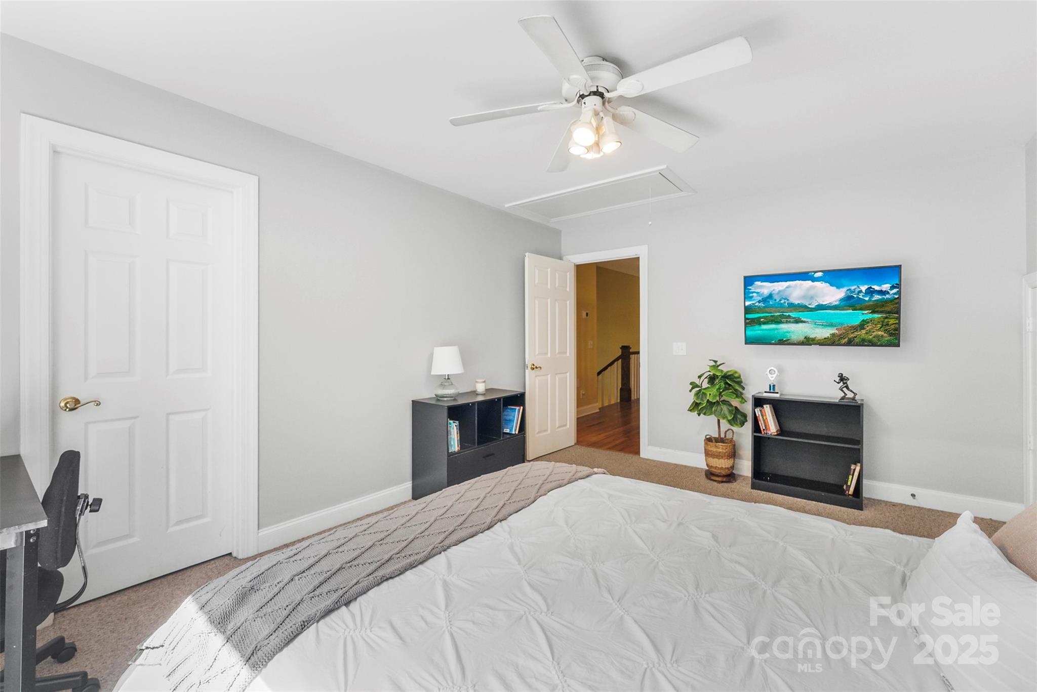 104 Tallwood Drive Shelby, NC 28152 - Photo 19 of 41 a bedroom with a bed and a chandelier