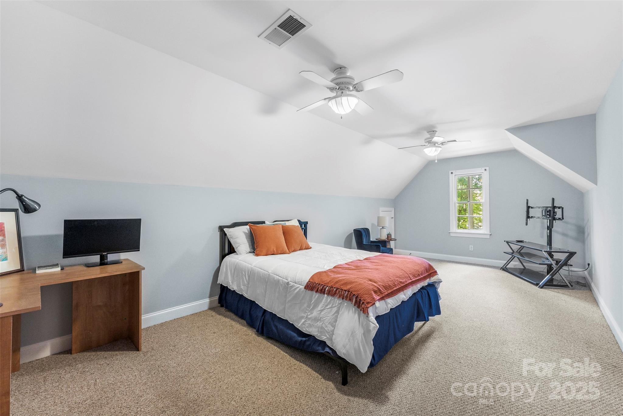 104 Tallwood Drive Shelby, NC 28152 - Photo 21 of 41 a bedroom with a bed and a tv on table