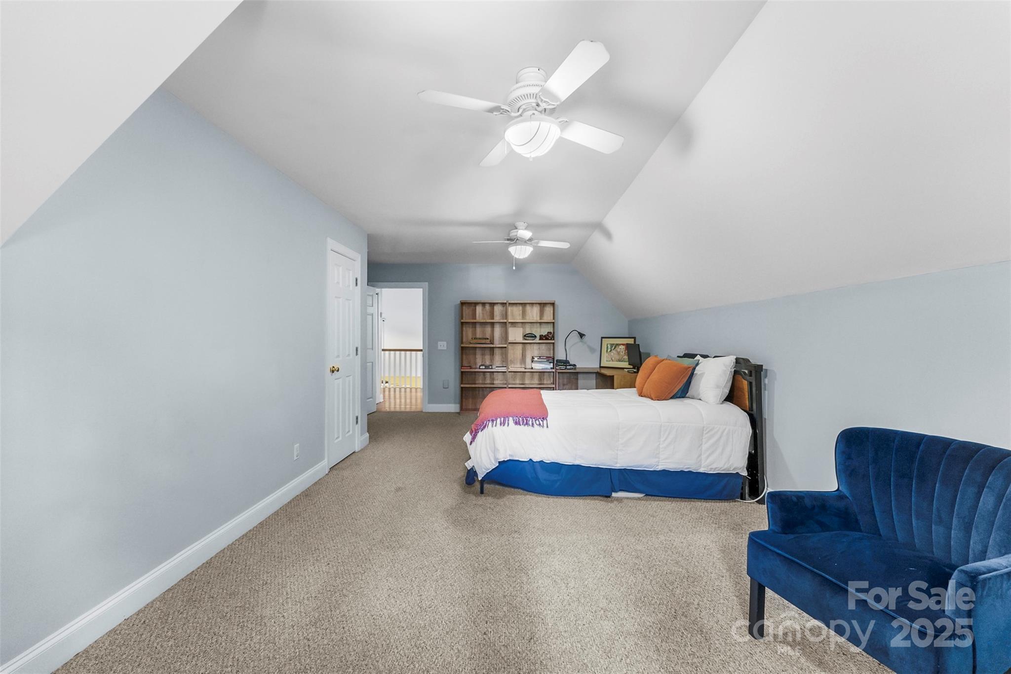 104 Tallwood Drive Shelby, NC 28152 - Photo 22 of 41 a bedroom with furniture and a chandelier