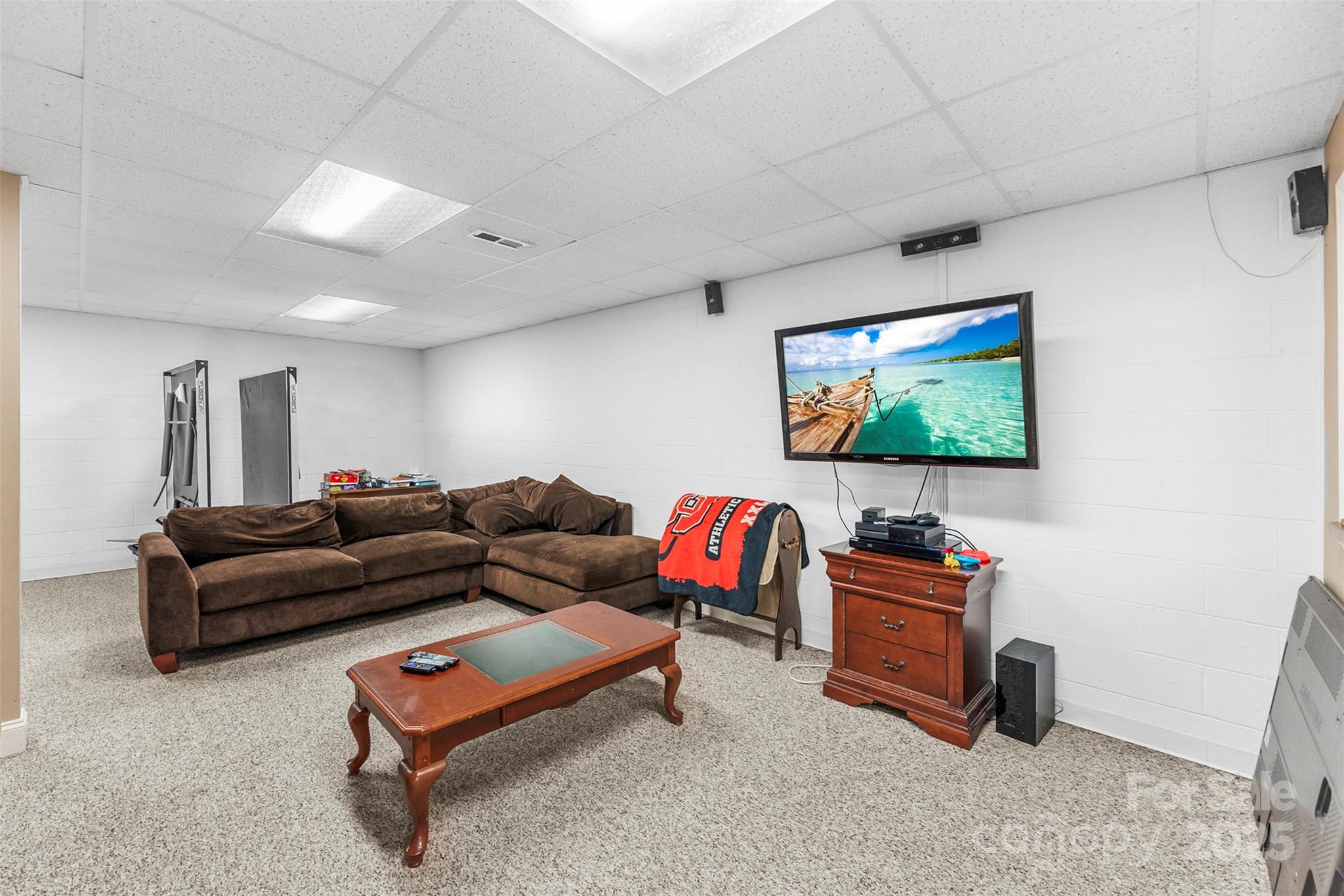 104 Tallwood Drive Shelby, NC 28152 - Photo 27 of 41 a living room with furniture and a flat screen tv