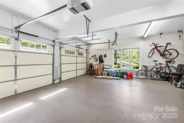 a view of a garage with a bike and car