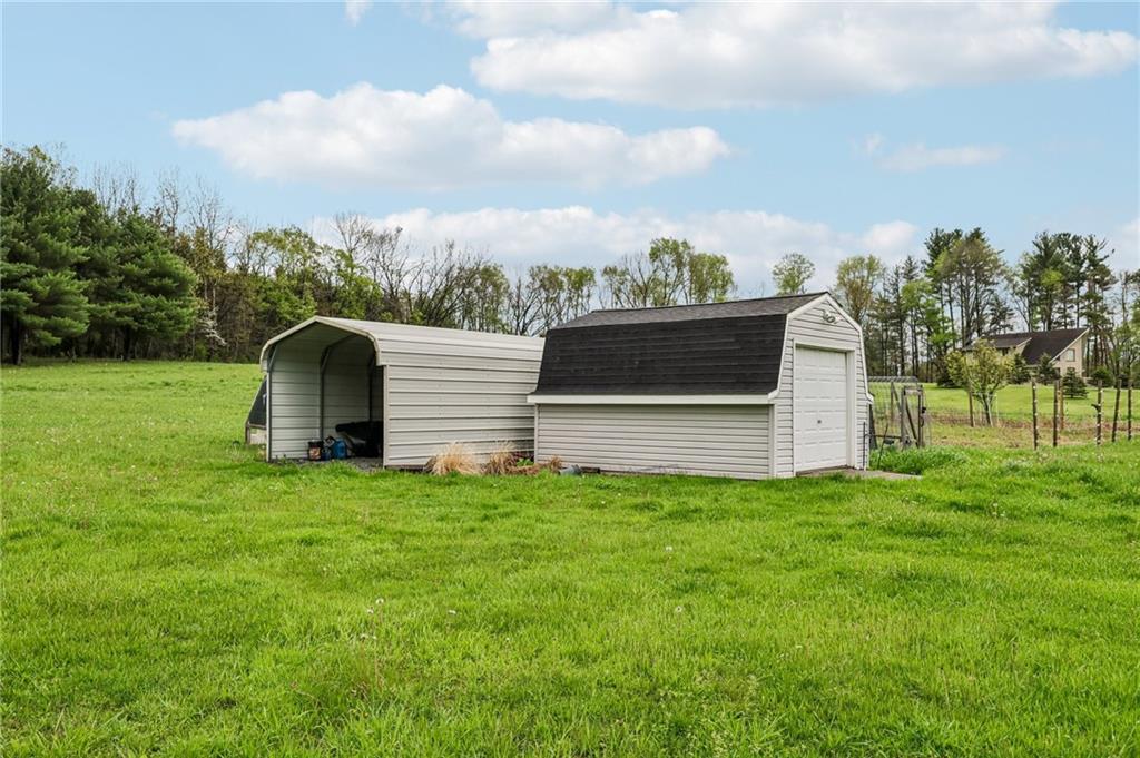 240 Hamburg Road Greenville, PA 16125 - Photo 36 of 41 the large fenced garden has a storage shed and extra unit for storage.