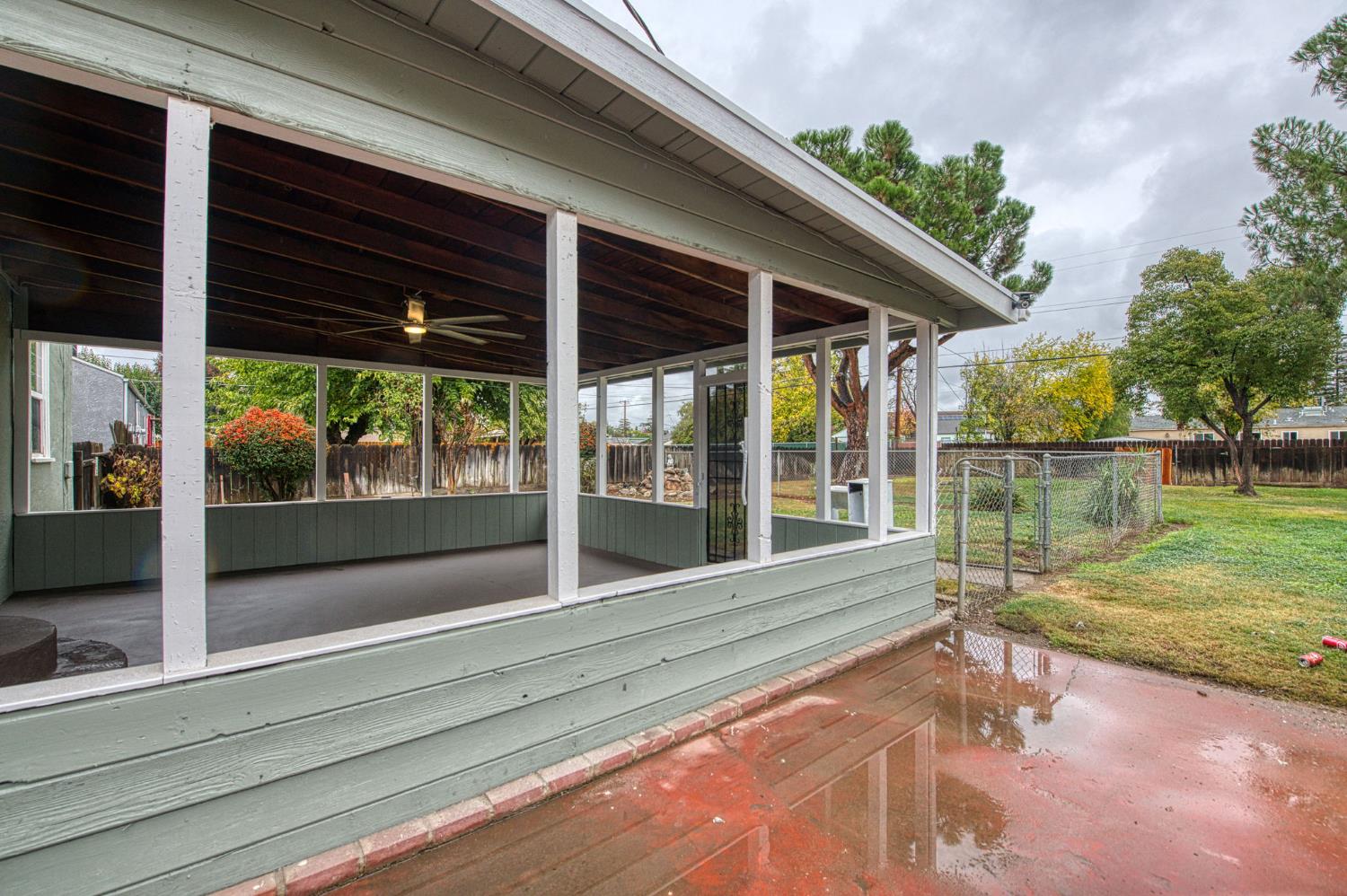 517 Rotan Avenue Madera, CA 93637 - Photo 20 of 32 a view of a house with a big yard and sitting area