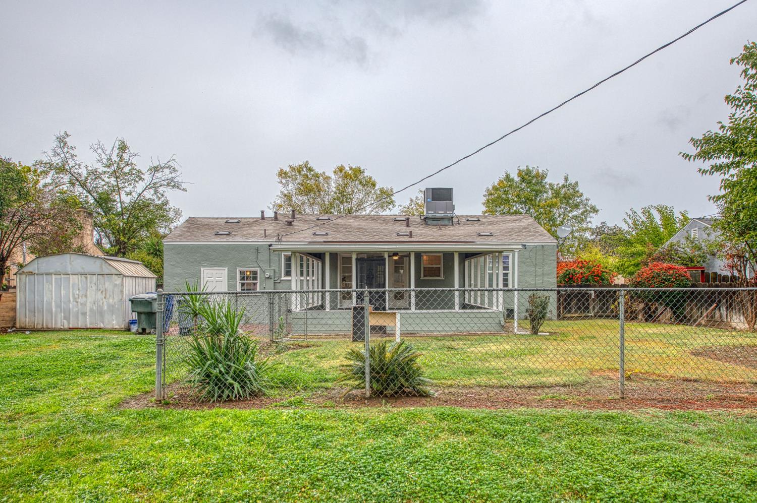 517 Rotan Avenue Madera, CA 93637 - Photo 27 of 32 a view of a house with a yard and sitting area