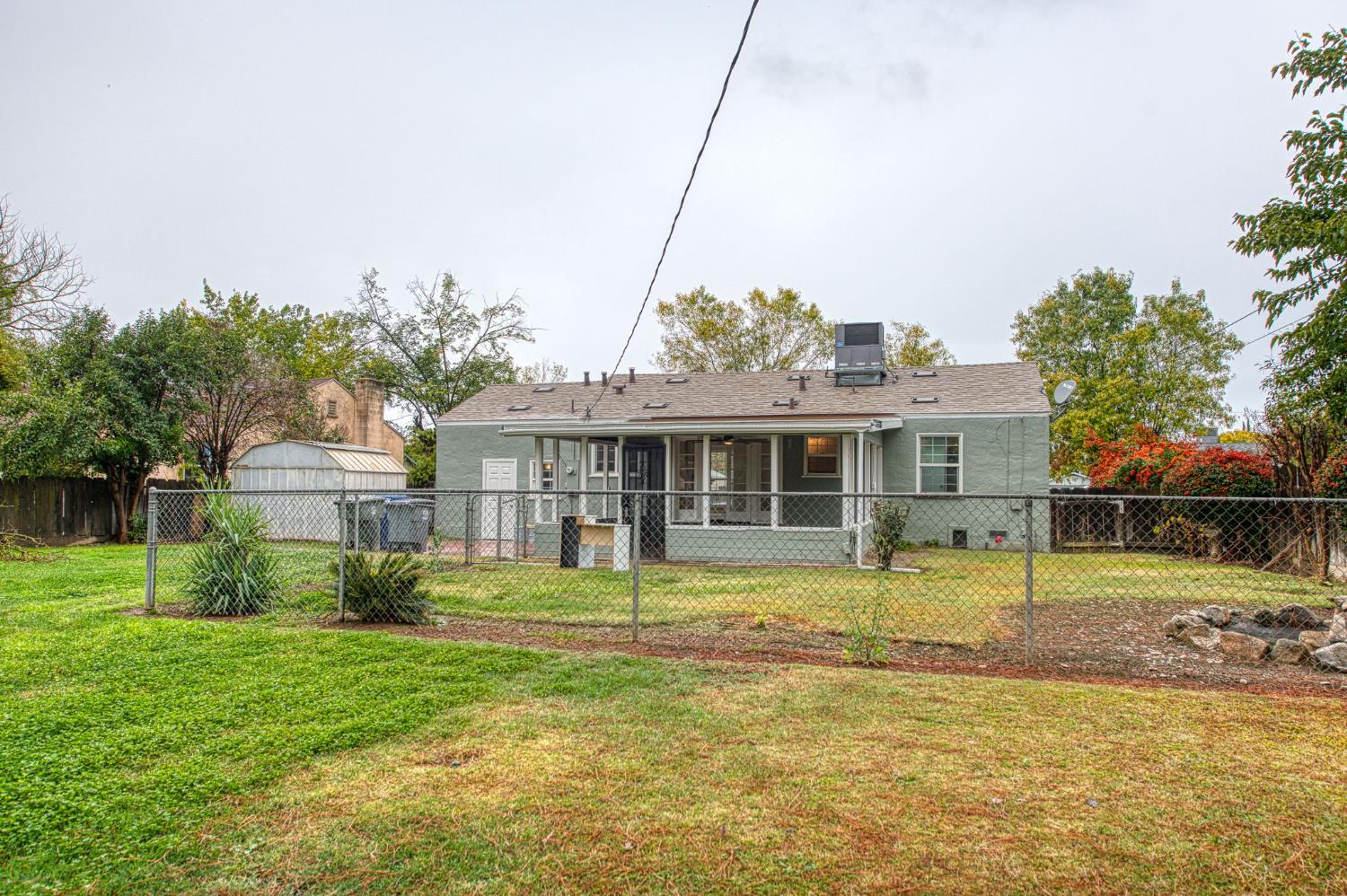 517 Rotan Avenue Madera, CA 93637 - Photo 28 of 32 a front view of a house with a yard table and chairs