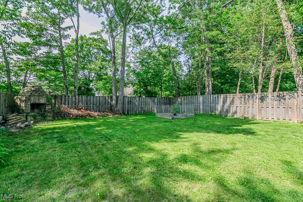 5195 Mayview Road Cleveland, OH 44124 - Photo 12 of 49 View of fenced backyard and fire place