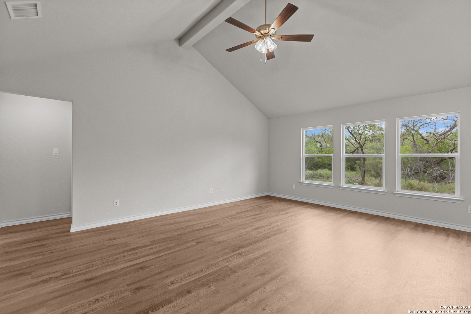 117 Sylas Hayes Loop Pleasanton, TX 78064 - Photo 11 of 38 a view of empty room with wooden floor and fan