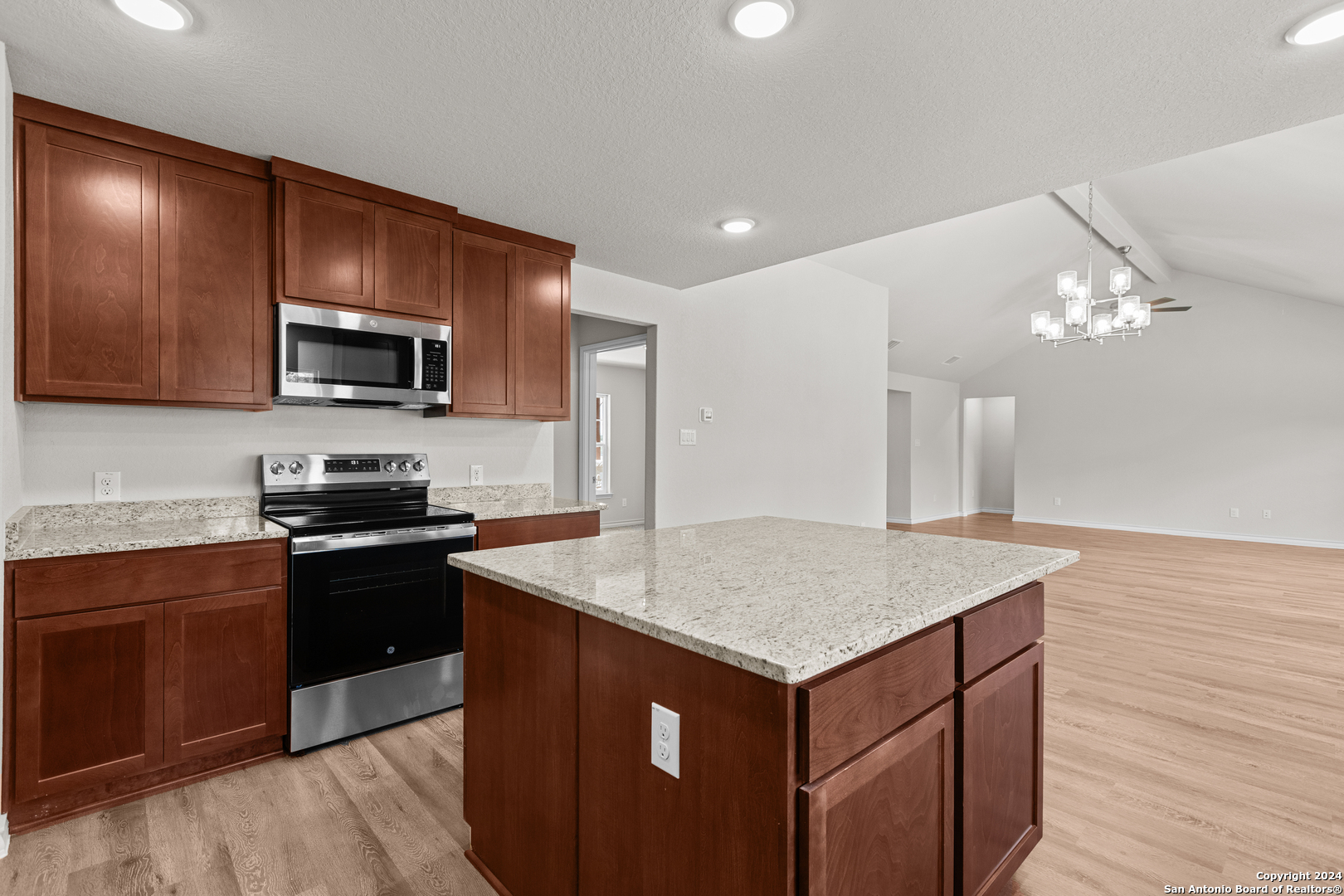 117 Sylas Hayes Loop Pleasanton, TX 78064 - Photo 20 of 38 a kitchen with a sink stove and microwave