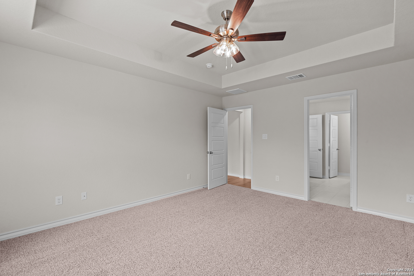 117 Sylas Hayes Loop Pleasanton, TX 78064 - Photo 28 of 38 a view of an empty room with a ceiling fan
