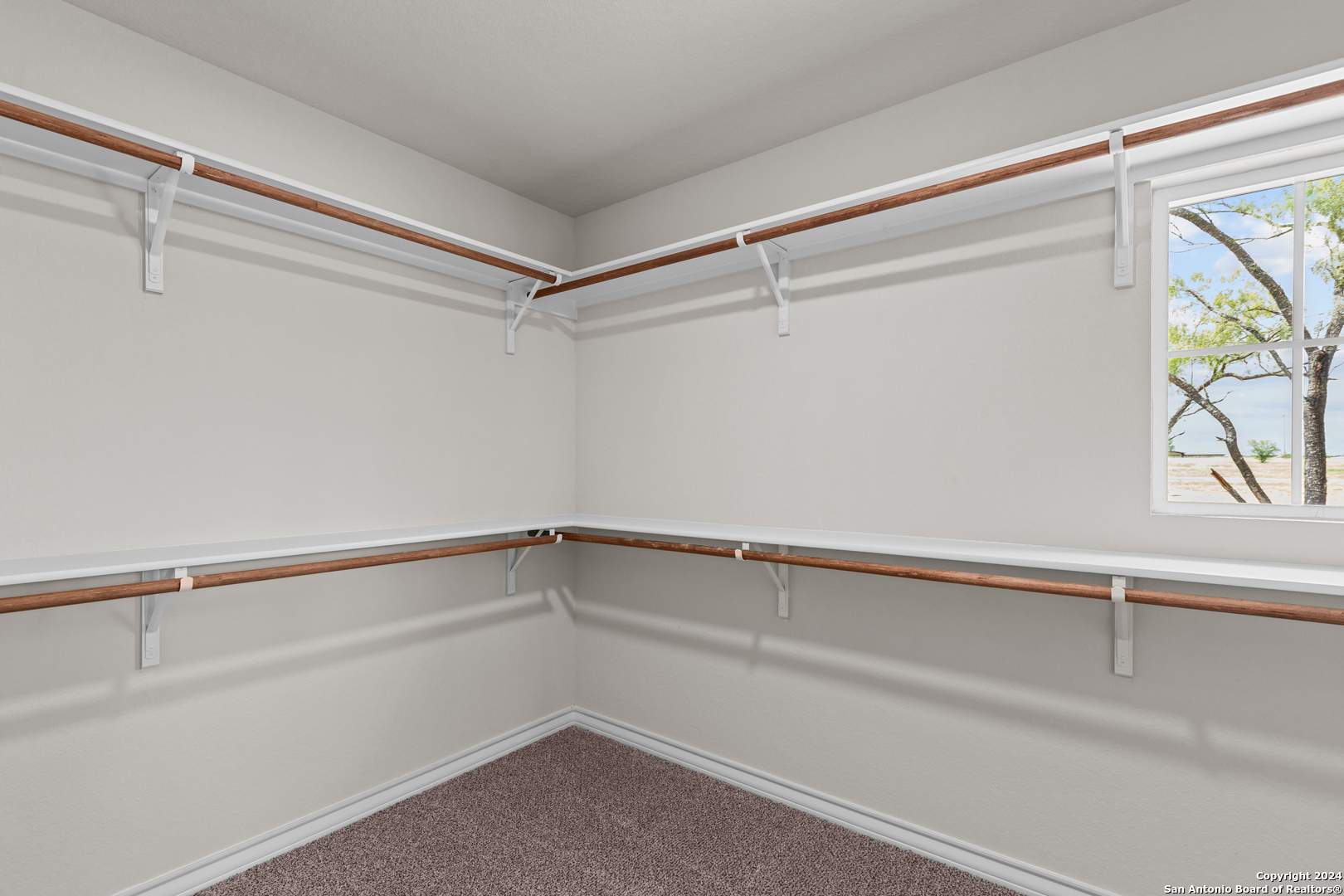 117 Sylas Hayes Loop Pleasanton, TX 78064 - Photo 31 of 38 a view of an empty walk in closet