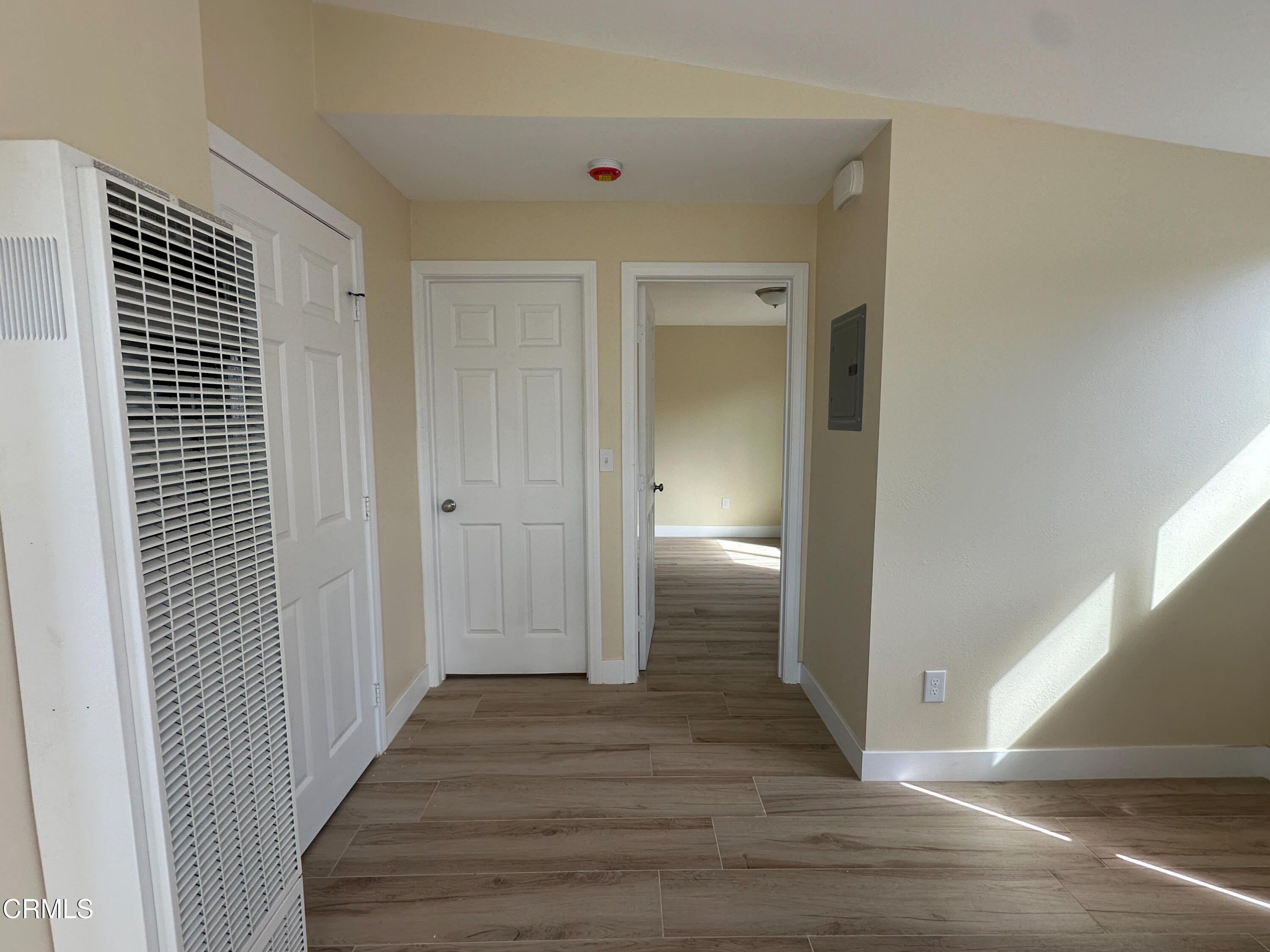 237 Brucker Road West, Unit 2 Oxnard, CA 93033 - Photo 2 of 6 a view of a hallway with wooden floor