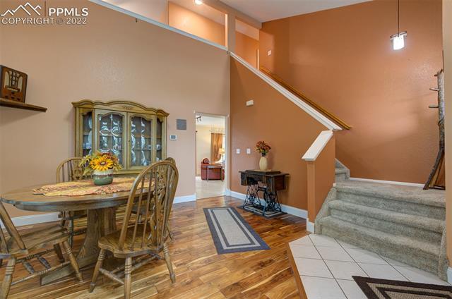 8252 Tompkins Road Peyton, CO 80831 - Photo 8 of 50 Dining Room, Showing stairs to Upper Level