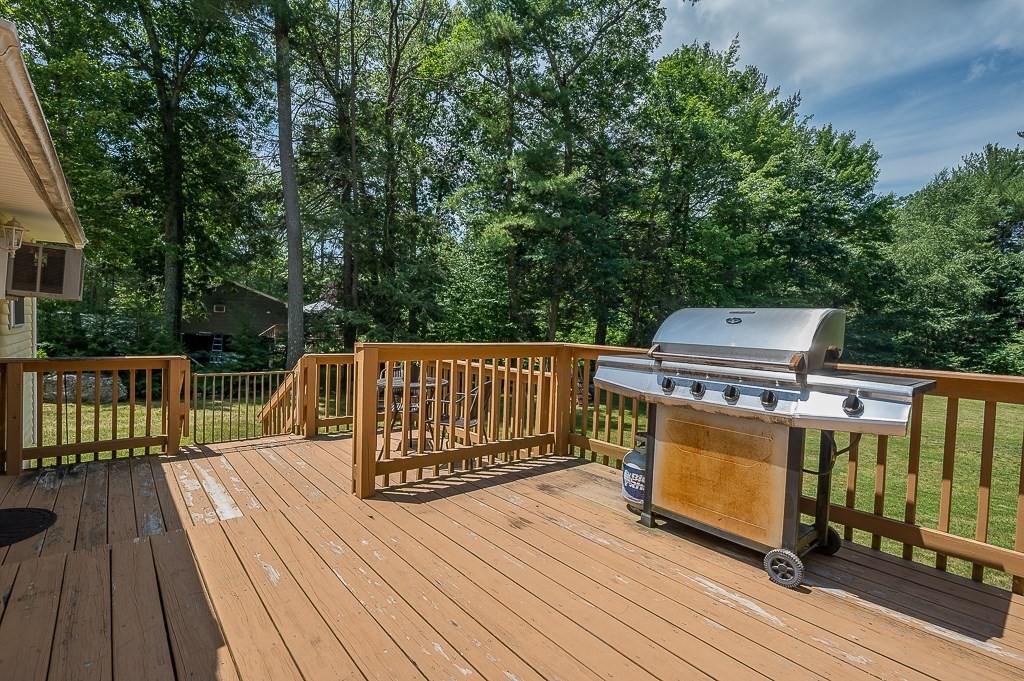 223 New Boston Road Sturbridge, MA 01566 - Photo 22 of 29 a view of a deck with wooden floor and fence
