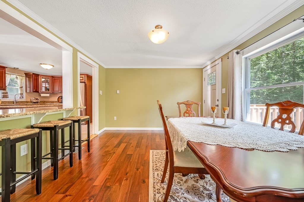 223 New Boston Road Sturbridge, MA 01566 - Photo 3 of 29 a dining room with furniture and wooden floor