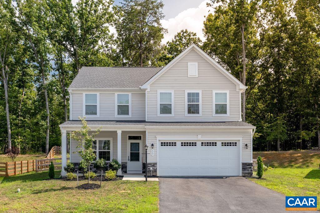 117 Island Hill Road Palmyra, VA 22963 - Photo 1 of 34 a front view of house with yard and trees in the background