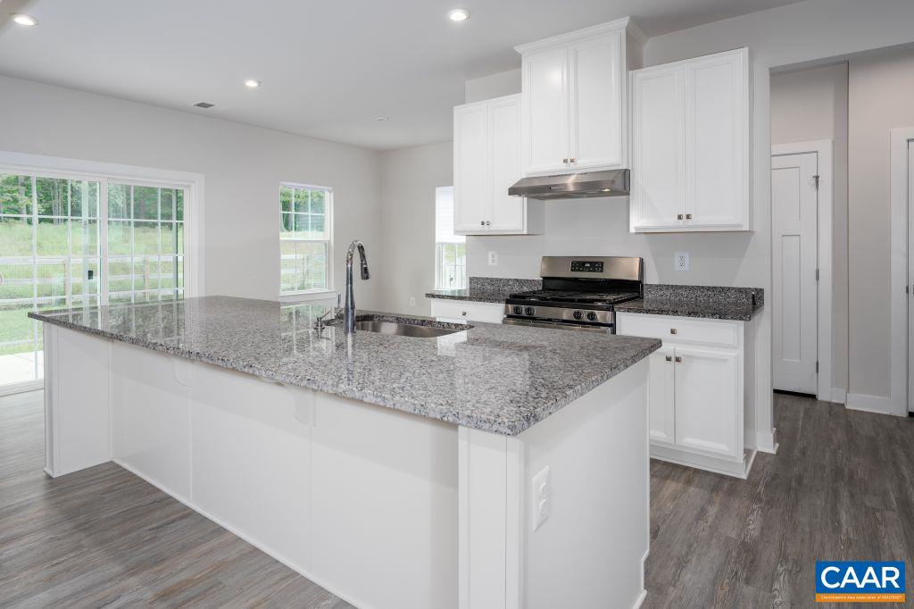 117 Island Hill Road Palmyra, VA 22963 - Photo 13 of 34 a kitchen with stainless steel appliances granite countertop a sink a stove and a wooden floors