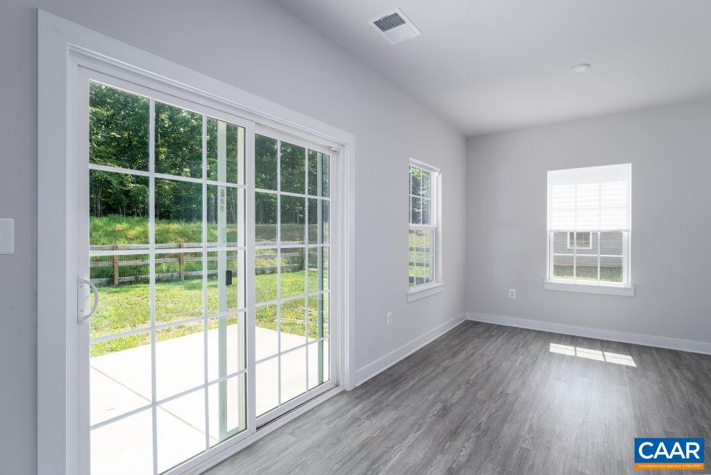 117 Island Hill Road Palmyra, VA 22963 - Photo 17 of 34 a view of an empty room with wooden floor and a window