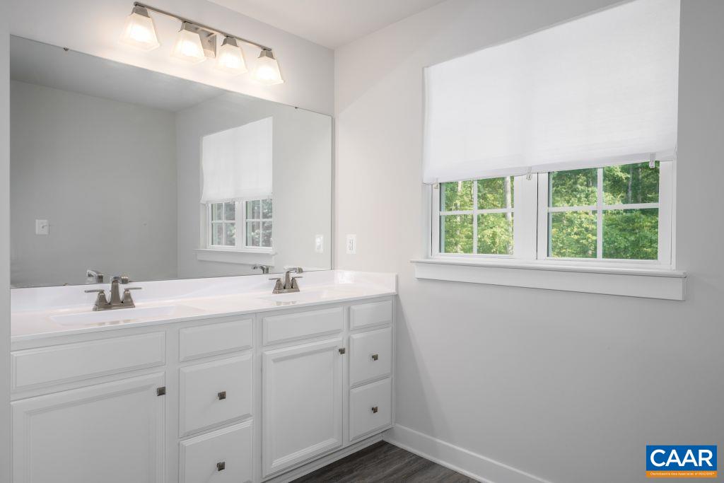 117 Island Hill Road Palmyra, VA 22963 - Photo 25 of 34 a bathroom with a double vanity sink window and mirror