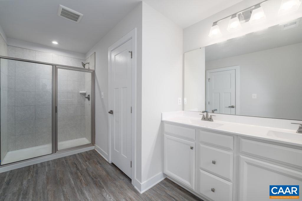 117 Island Hill Road Palmyra, VA 22963 - Photo 27 of 34 a bathroom with a double vanity sink and mirror